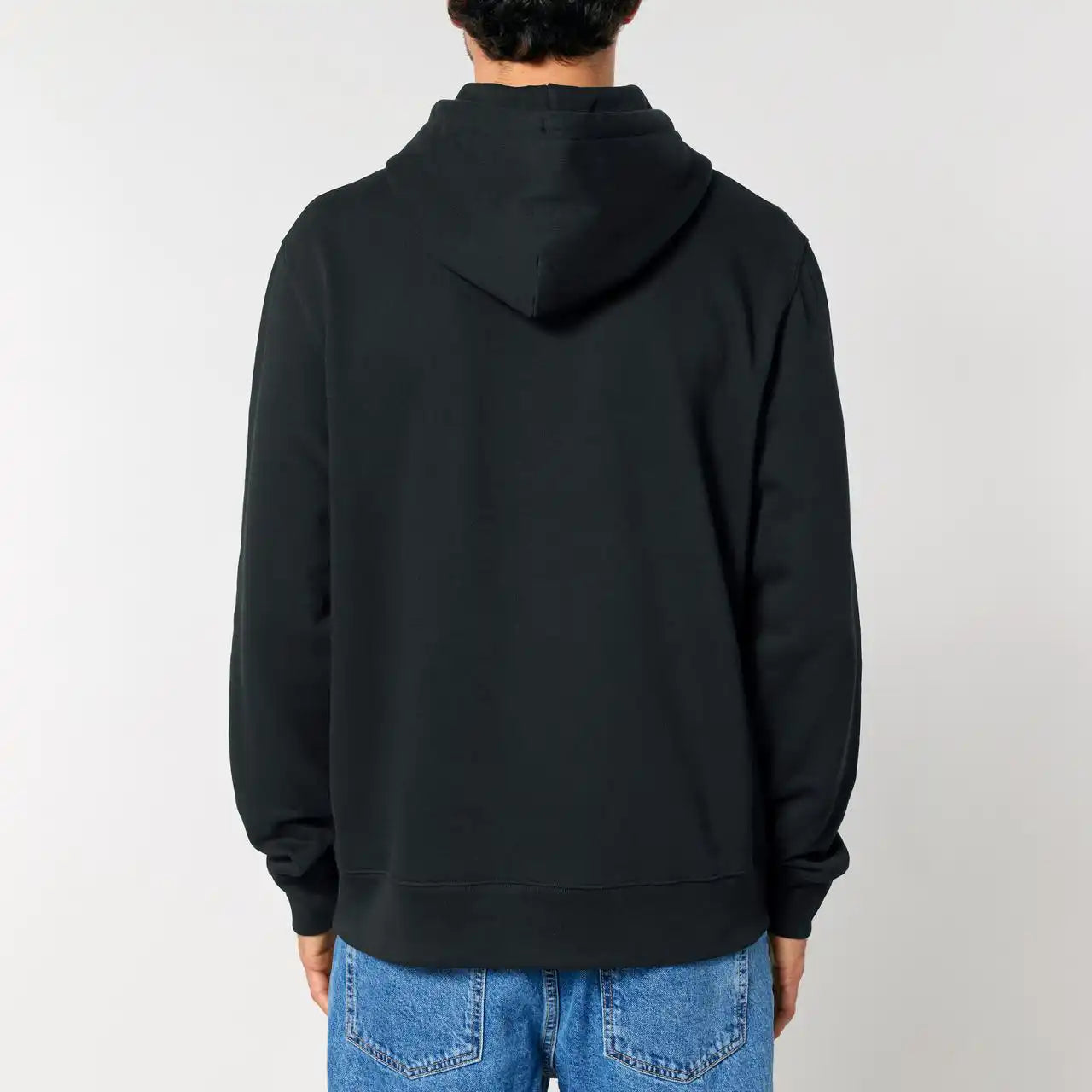 Back view of a guy wearing a bitaxe hoodie