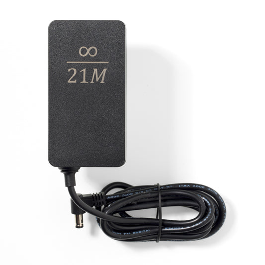 Picture of the Nerdaxe Gamma power supply with infinity / 21M engraving.