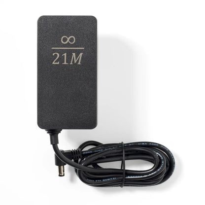 Picture of the Nerdaxe Gamma power supply with infinity / 21M engraving.