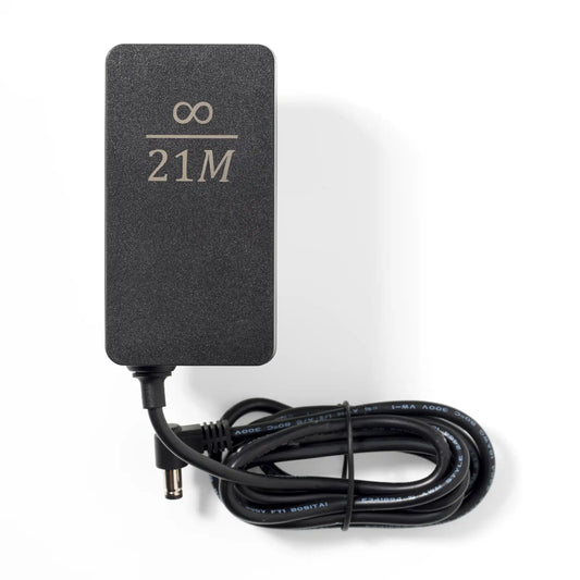 Picture of the Nerdaxe Gamma power supply with infinity / 21M engraving.