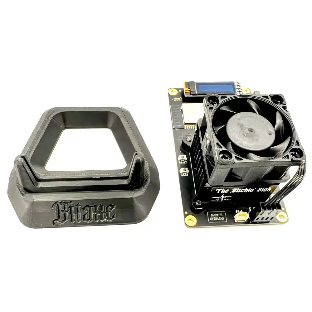 Bitaxe 602 Gamma bitcoin miner next to bitcoin stand